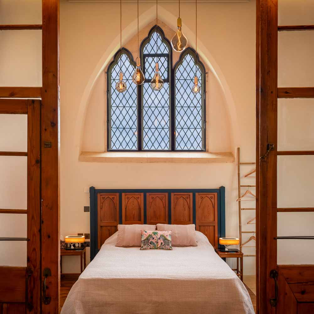 Bedroom with church style leaded light window