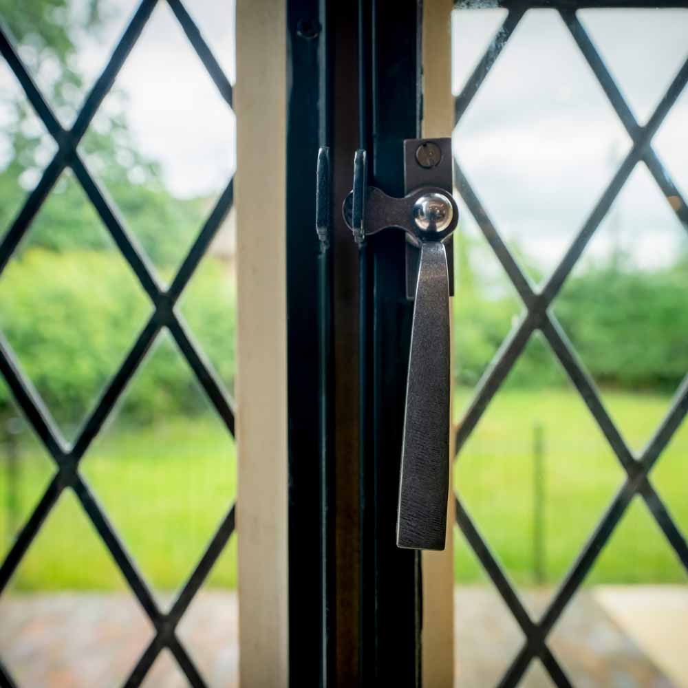Leaded light window with traditional ironmongery
