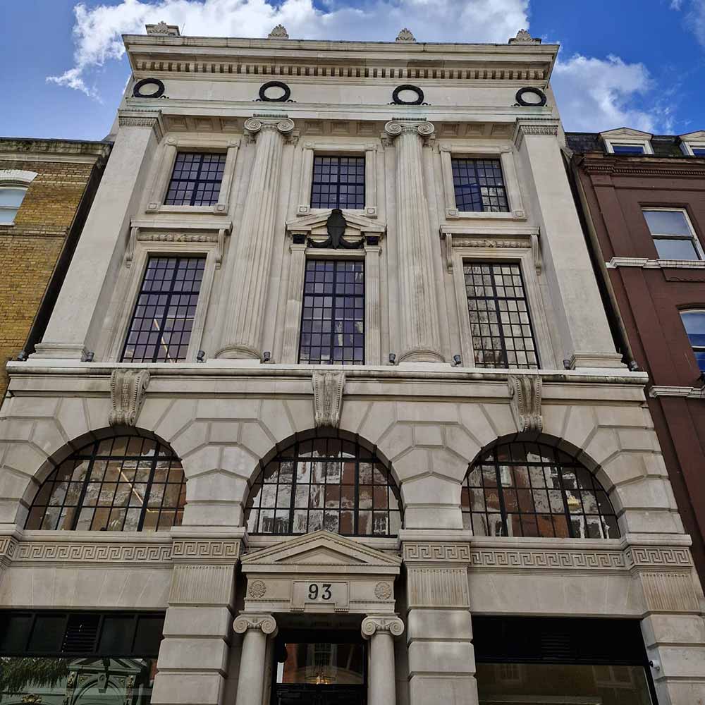 Historic building facade with traditional metal windows