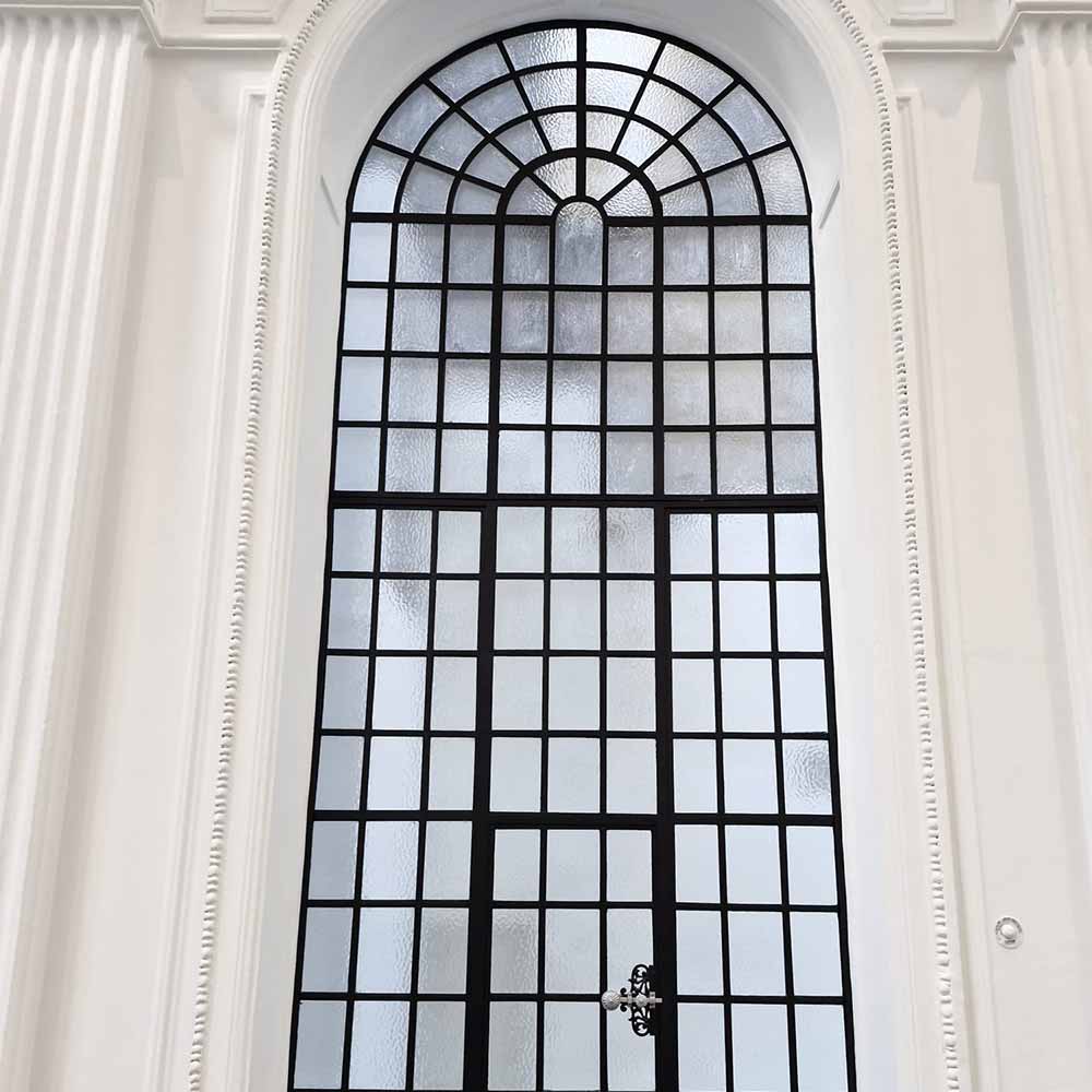 4-metre-tall replacement heritage window with 54 individual panes, complete with ornate brass ironmongery 