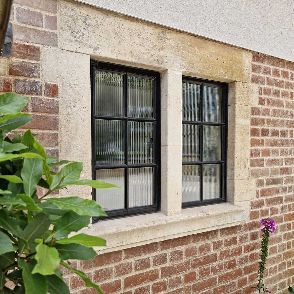 Replacement subdivided steel windows with fluted glass