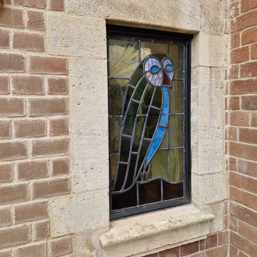 Restored stained glass window of an owl